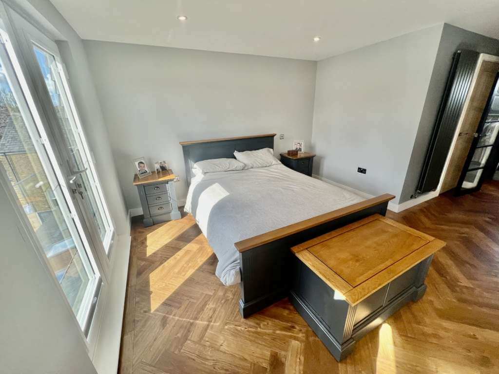 Main bedroom in the completed Hoddesdon hip-to-gable conversion